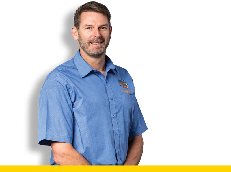 Cooper Automotive Owner and Director Mark Cooper facing camera and smiling